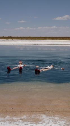 Isabelle Legeron floating in the turquoise salt lagoons of the Atacama