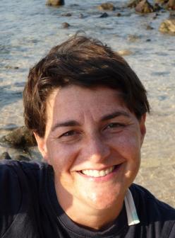 Isabelle Legeron smiling on a beach