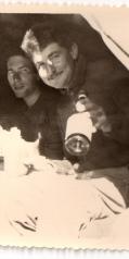 Vintage black and white photograph of Pierre Legeron holding a wine bottle